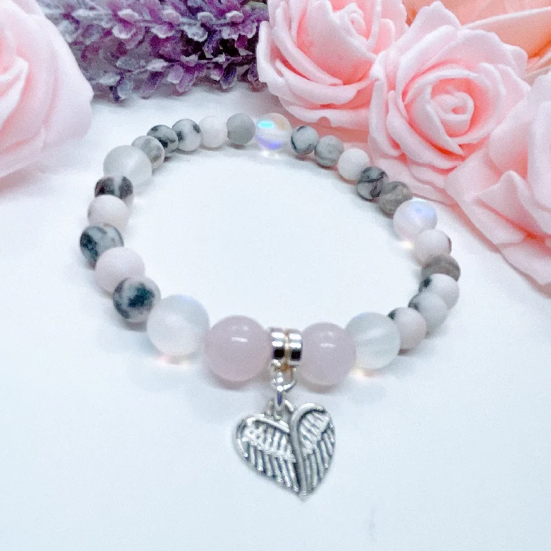 personalized bracelet with engraved coordinates for honeymoon-Angel Wings Heart Companion Charm Bracelet Rose Quartz